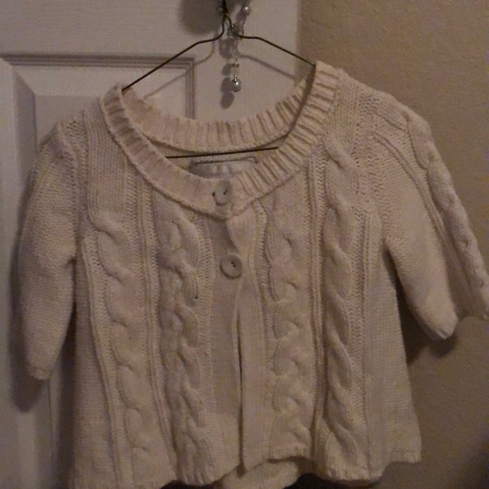 It is a white coat/jacket